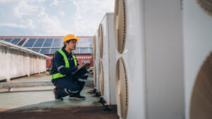 Engineers is checking the air conditioning cooling system of a major building or industrial facility.